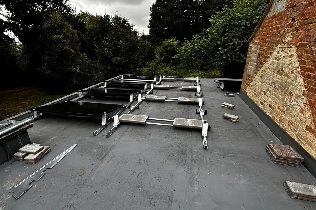 Mounting frames installed across a flat roof before the panels