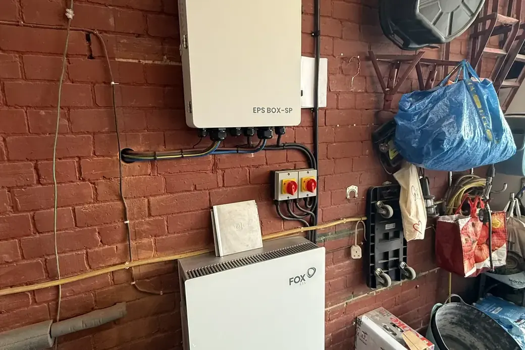 FOX inverter and battery unit mounted on a garage wall