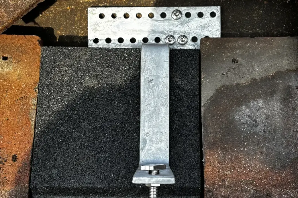 Renusol roof hook fixed to the roof structure beneath a lifted tile