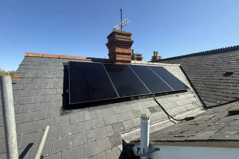 Completed 9.5kWp black solar array on a slate roof in Reading, Berkshire