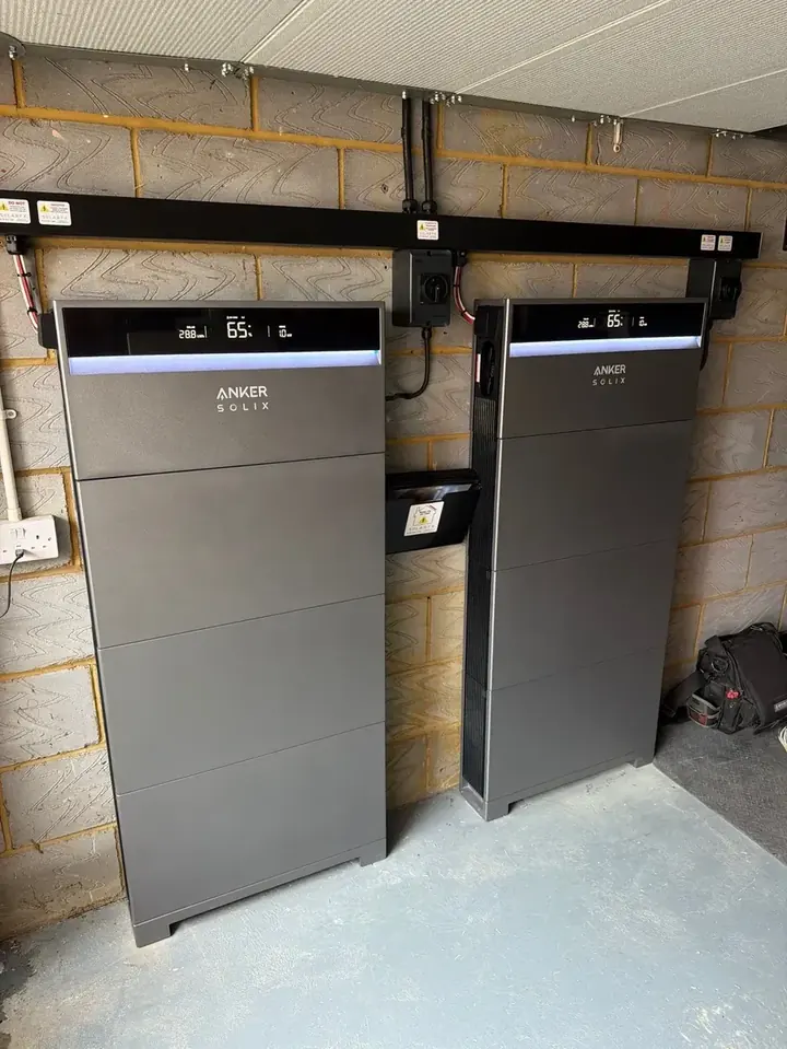 Two Anker SOLIX X1 battery towers installed at ground level in East Horsley
