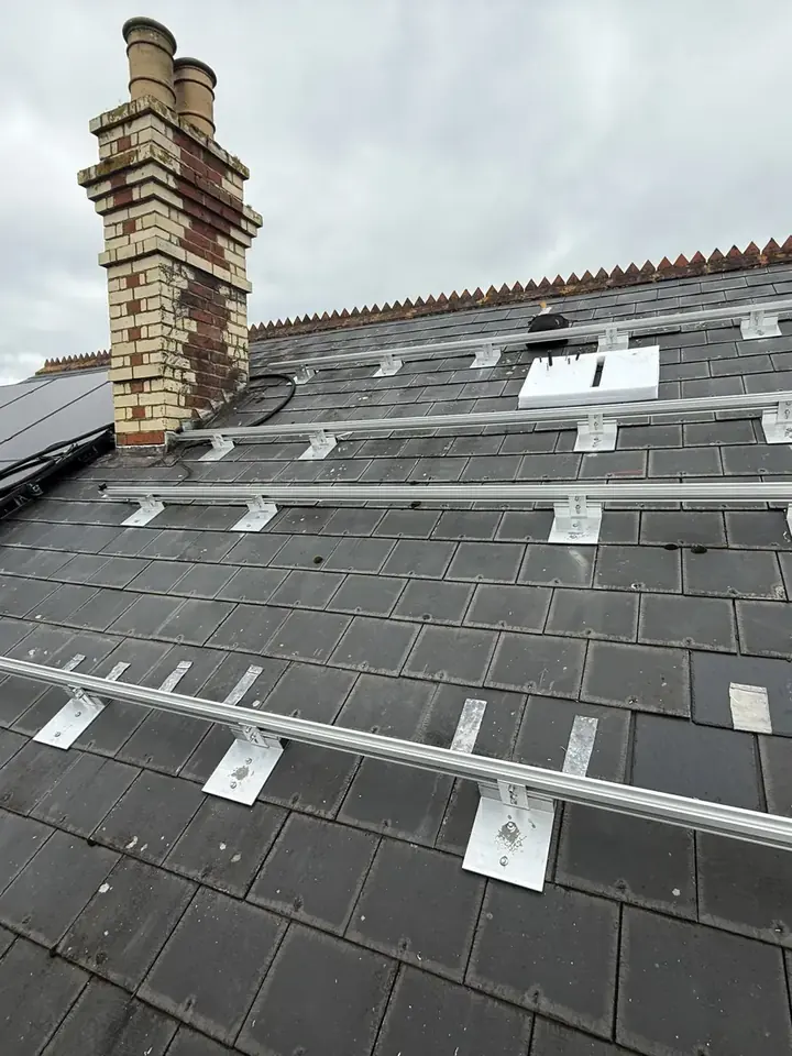 Mounting rails and fixing points positioned across a slate roof