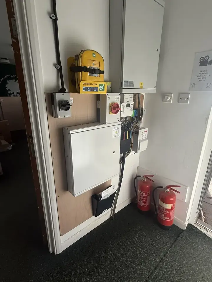 Inverter and distribution equipment mounted on an internal wall